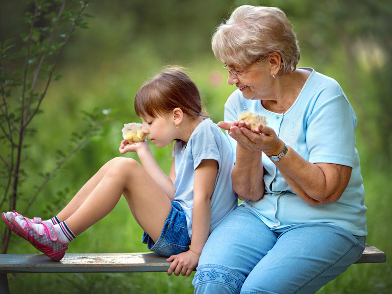 grandmother and granddaughter outside