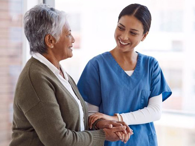nurse helping patient