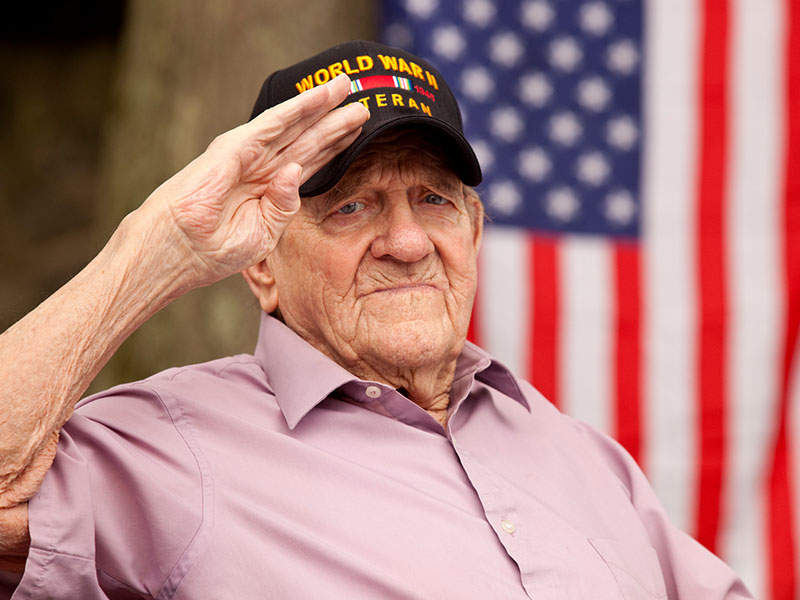 World War Two, Veteran wearing cap with text